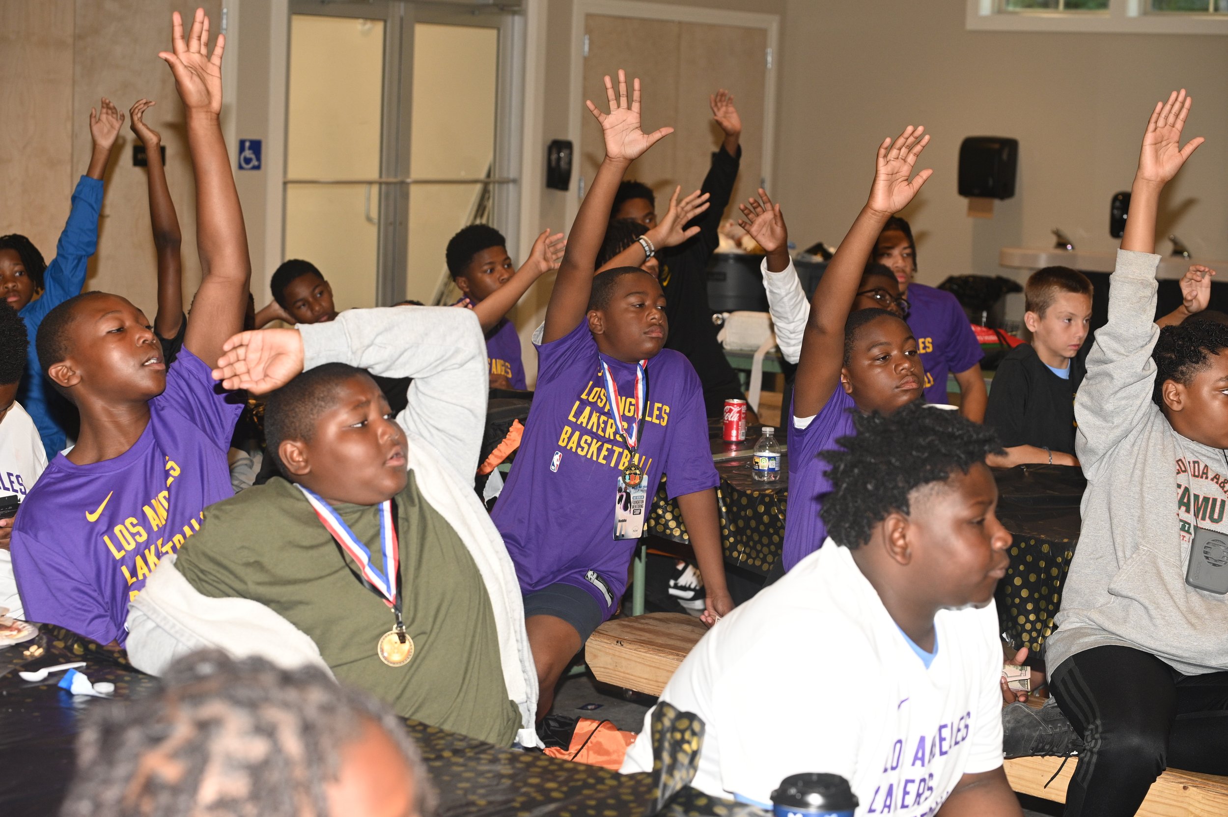 Nate McMillan with young men at a foundation event
